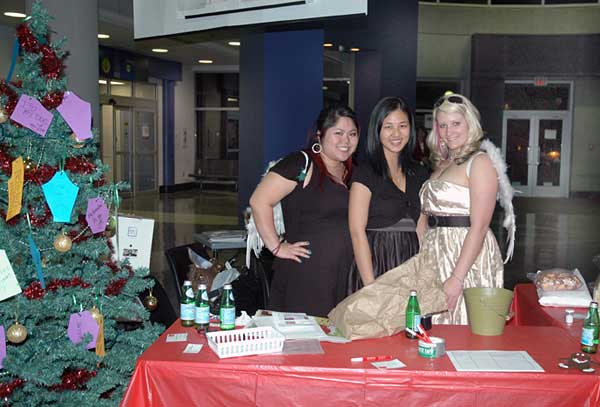 (From left) Niki Chung, Carolyn Chow and Janis Brunk, all fourth year Fashion Design students, fundraise for the Julie Hobart SOS scholarship, in the Richmond Kwantlen rotunda on Dec. 4. (Keira Simmons photo)