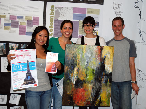 (From left to right) Third-year Interior Design students Whitney Chow, Anni Mergeran, Beatrice Muschol and Lucas Nightingale show off their advertising and an oil painting that will be featured as part of their silent auction at IDSwest.