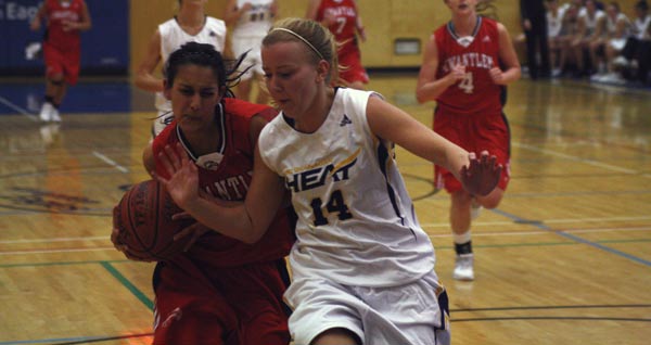 Taminder Dhaliwal (left) drives to the hoop against UBCO player Bailey Radley. (Mitch Thompson photo)