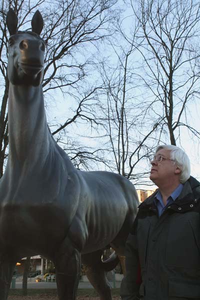 Bill Purver, archivist for the City of Richmond, examines a statue of Minoru commissioned by the city to honour the popular racehorse.