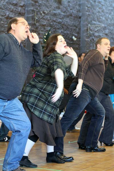 Jennifer Campbell joins her fellow actors in one of the plays many choreographed dane routines. (Katie Lawrence photo)