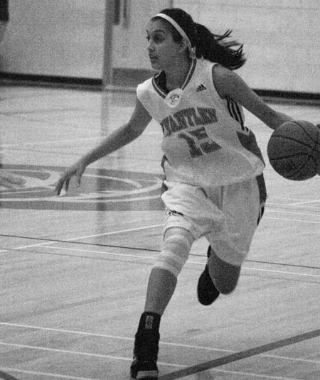 Taminder Dhaliwal drives up court against Vancouver Island University Friday. (Katie Lawrence photo)