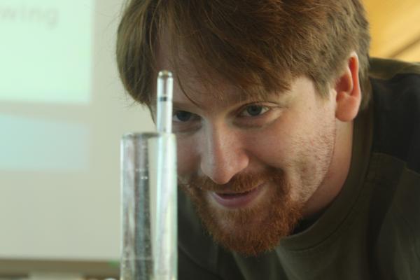 Nathan Griffiths shows how to use a hydrometer to measure alcohol at the Cloverdale campus on Jan. 19. (Jacob Zinn photo)